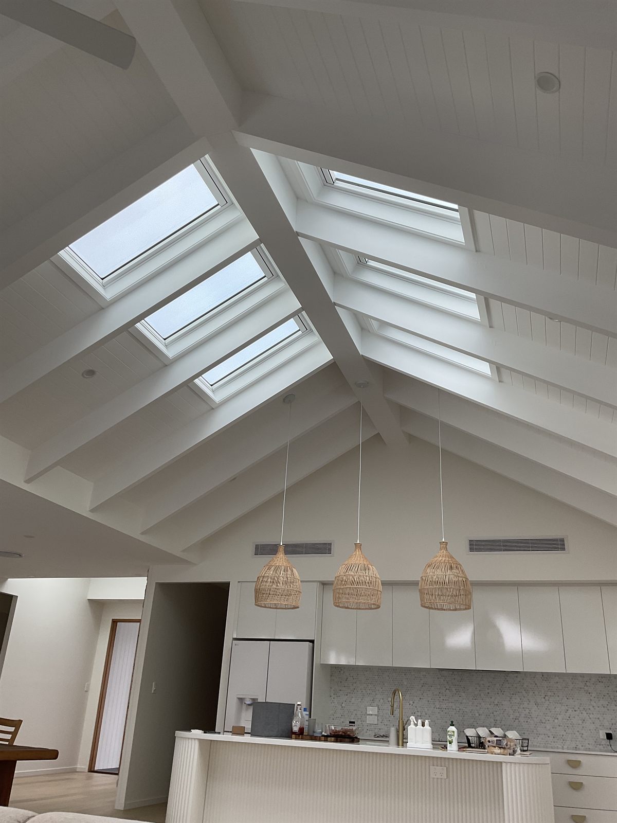 Finished interior with Velux skylights bringing natural light into a vaulted ceiling