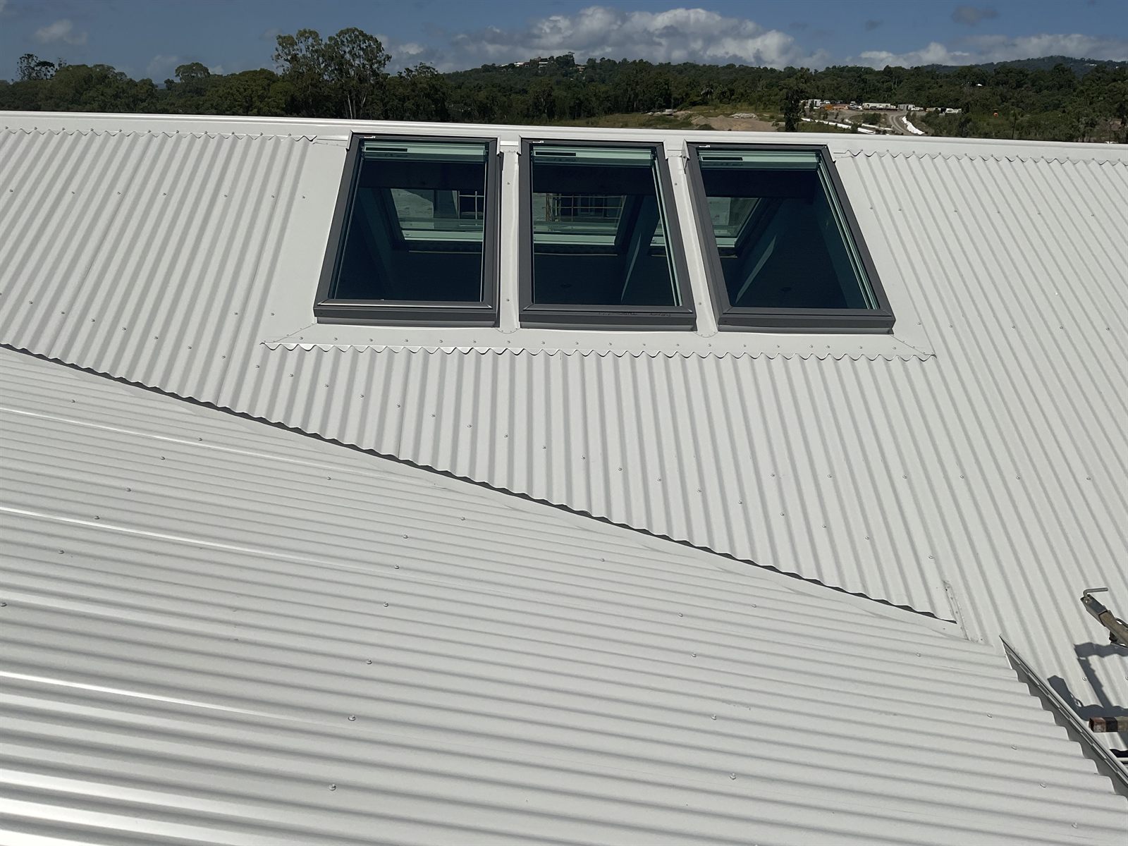 Velux skylights installed with custom Colorbond flashings on a metal roof