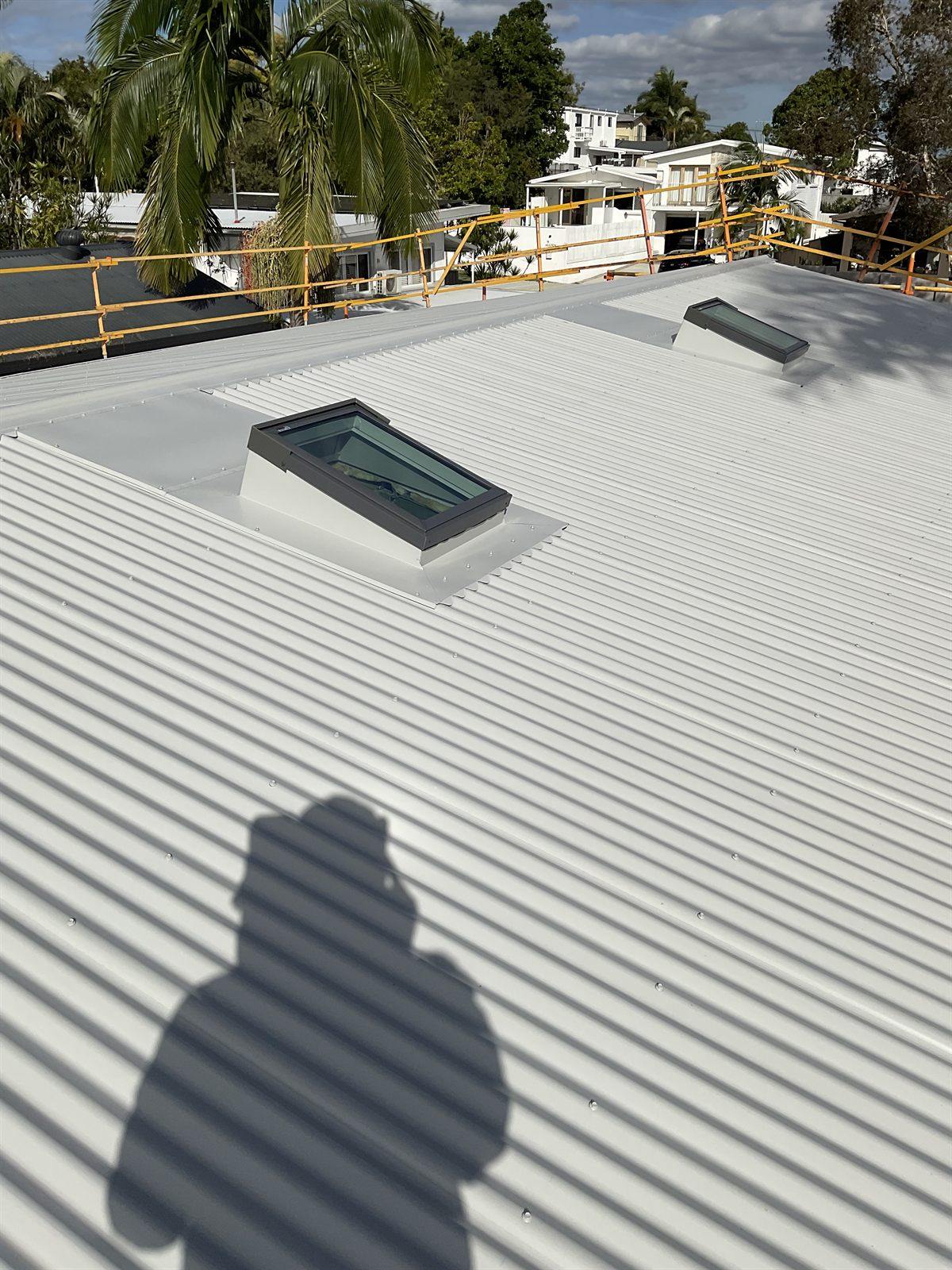 A skylight on a metal roof overlooking a Northern Rivers coastal town