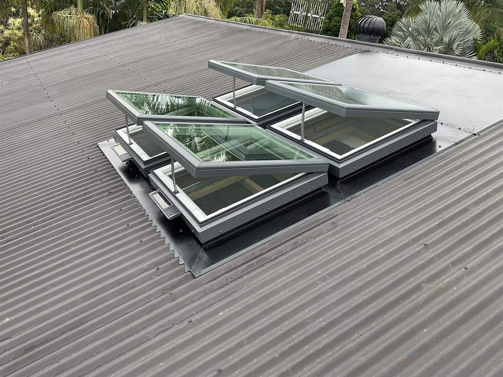 A bank of Velux openable skylights installed on a Colorbond metal roof in the Northern Rivers